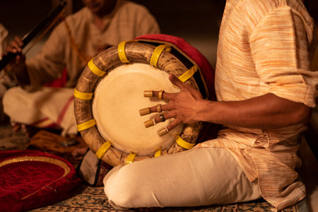 A selective of a man playing Indian Nadaswaram during a religious festivalの写真素材