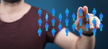 A 3D rendering of a businessman pointing at a group of blue people icons