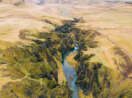 A beautiful aerial view of a canyon with rocks covered in moss in Icelandの写真素材