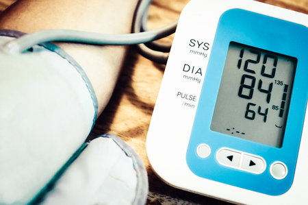 A closeup shot of a tonometer attached to a human arm showing resultsの写真素材