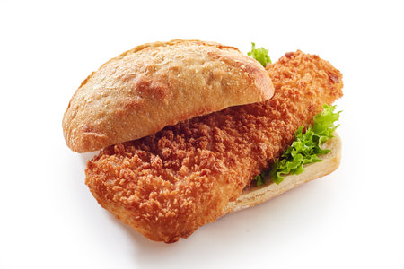 A closeup of a sandwich with delicious haddock fishcake on a white backgroundの写真素材