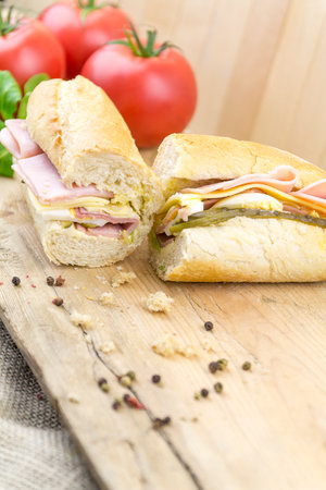 A closeup of a delicious sandwich with ham and cheeseの写真素材