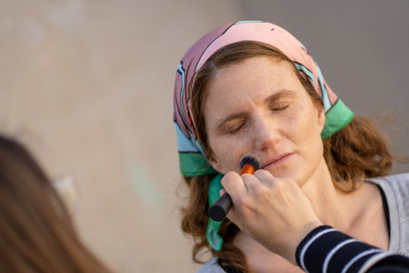 The professional make-up process of the mid-aged female with short hairの写真素材