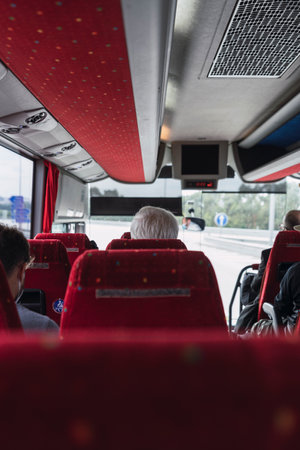 A vertical shot of passengers in a busの写真素材