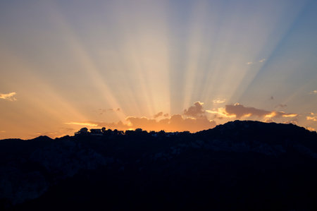 A silhouette of a landscape under the beautiful sunset skyの写真素材