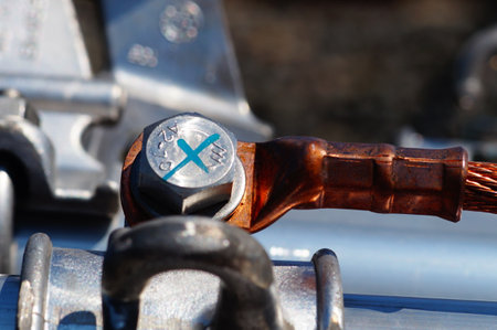 Detailed view of a copper cable on a cantilever. Ready-to-mount components of an overhead line on a...