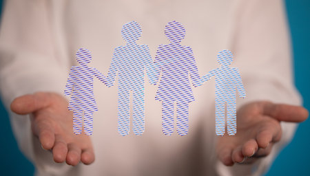 A 3D rendering of digital family figure floating on human hands-protection and care conceptの写真素材