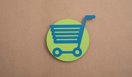 A Shopping Cart Flat Design E-Commerce Icon concept on a brown backgroundの写真素材