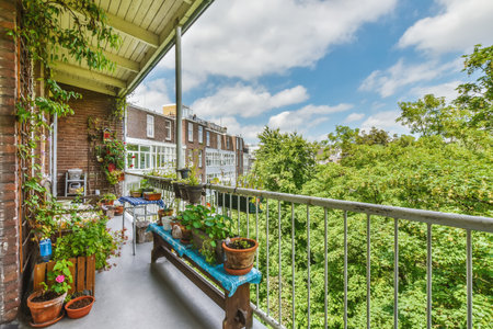 A beautiful shot of an apartment balcony with a lot of plants iの写真素材