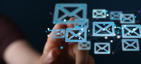 A hand showing email icon on screen - concept of business communicationの写真素材