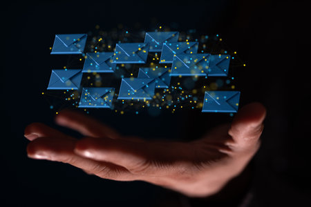 A human hand showing network communications with email symbolの写真素材