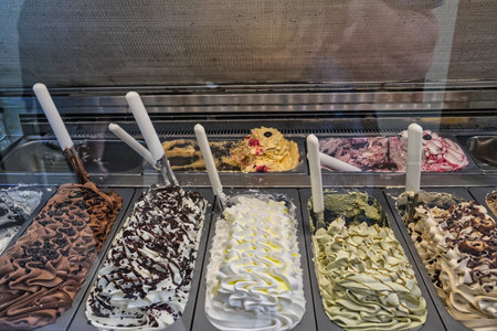 Display case in an Italian bar with colorful Italian ice creamの写真素材
