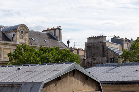 A vertical shot of the view of town buildings and roofsの写真素材