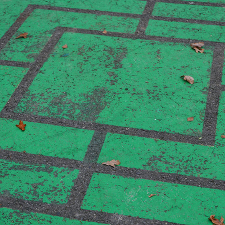 A faded green maze court background