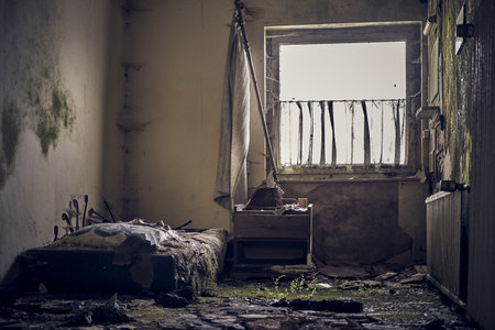 A scene of a crushed, abandoned, forgotten bedroom.の写真素材