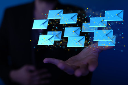 A hand showing email icon on screen - concept of business communicationの写真素材