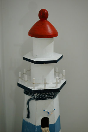 A beautiful wooden lighthouse toy indoorsの写真素材