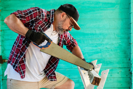 A Caucasian repairman in a workshop