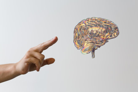 A human's fingers interacting with a Human brain Anatomical Model, 3d render, Isolated backgroundの写真素材
