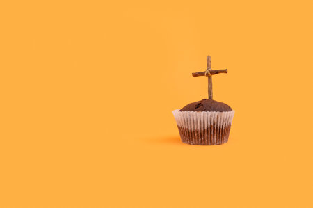 the Muffin and wooden cross as Halloween conceptの写真素材
