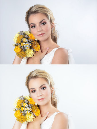 A beautiful Caucasian bride in an elegant wedding dress posing on white backgroundの写真素材