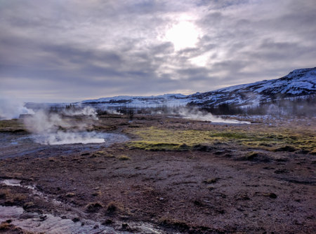 A magical scene of steam rising out of springs in Icelandの写真素材