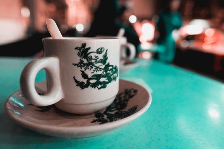 A close-up shot of an Ipoh white coffee in a white cup on the table in Kuala Lumpur, Malaysiaの写真素材