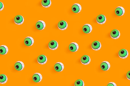 Many round eye toys on an orange background