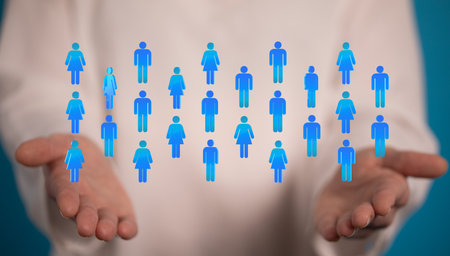 An abstract shot of a man showing 3D rendered contact icons global networking on the webの写真素材
