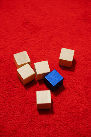 The wooden  blocks on red carpet