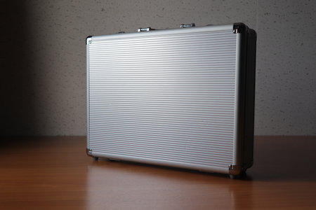 A metal suitcase on the tableの写真素材
