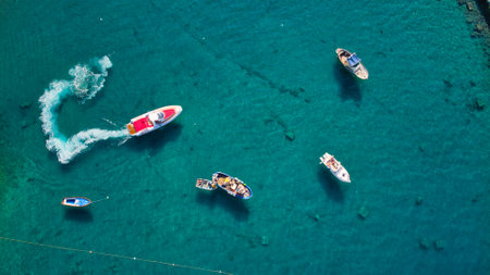 An aerial shot of boats on turquoise waterの写真素材