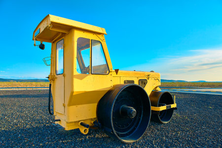 A road construction heavy equipment on the site on a sunny day