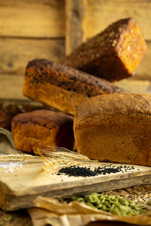 The fresh homemade bread cut into slices in a kitchen