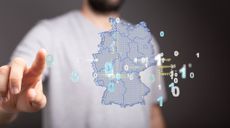 A man is touching the map of Germany consisting of 3D rendering triangles, linesの写真素材