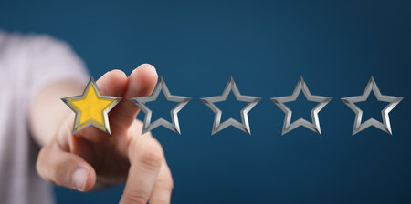 A 3d rendering of a review icon and rating stars showing a feedbackの写真素材