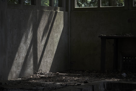 An empty abandoned room full of dust.の写真素材