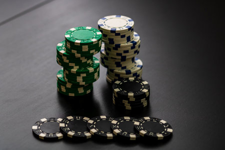 A closeup of stacks of poker chips of different values placed on the poker table; gambling conceptの写真素材