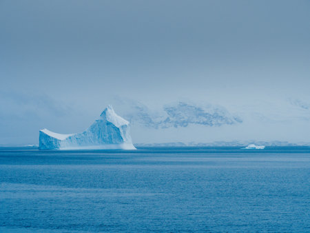 A beautiful landscape with snowy mountains and glaciers in Antarcticaの写真素材