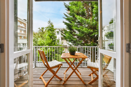 A beautiful image of a tiny outdoor balcony with a green view; design ideasの写真素材