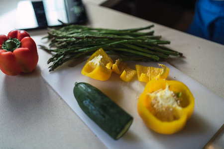 A closeup shot of vegetables on a cutting board for healthy food preparationの写真素材
