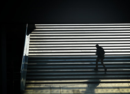 A high angle view of a human silhouette exiting from the underpass