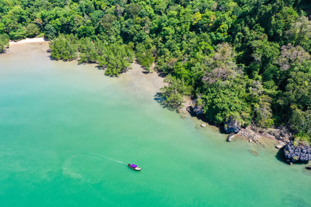A beautiful view of nature with a calm, blue sea and islands in Thailandの写真素材