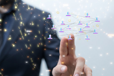 A 3D rendering of a businessman pointing at a group of people iconsの写真素材