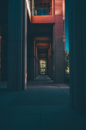 An empty outdoor corridor of a building lined withの写真素材