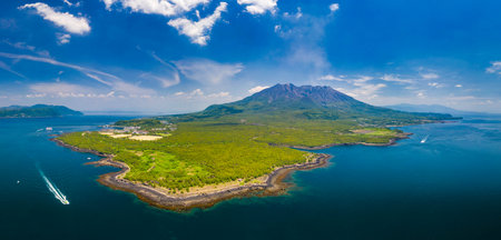 An aerial shot of Sakurajima volcano against a cloudy skyの写真素材