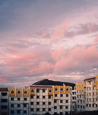 A colorful image of buildings in a block, at sunset.の写真素材