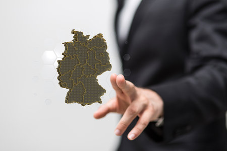 A human hand showing Germany map networkの写真素材