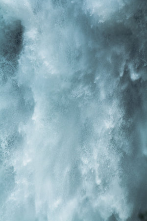 Close-up of water falling down a mountain.