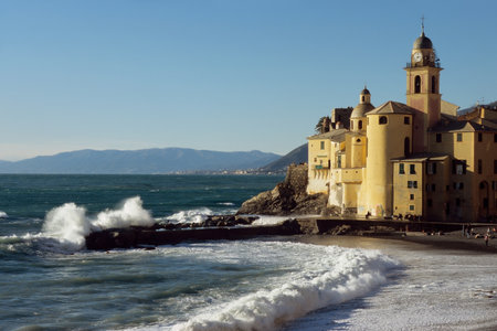 A beautiful view of a beach and a church. Finale, Ligure, Italyの写真素材